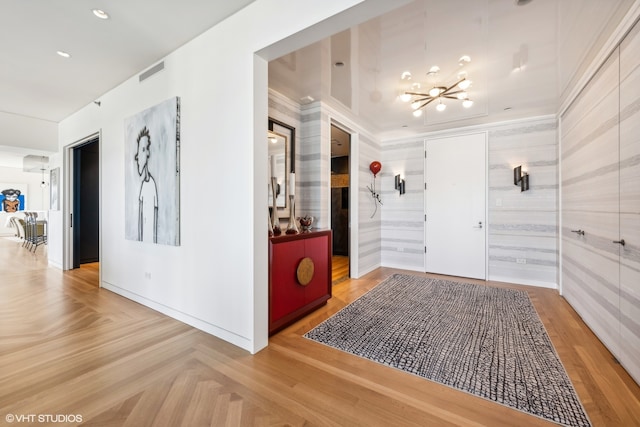 hall featuring ornamental molding and parquet floors