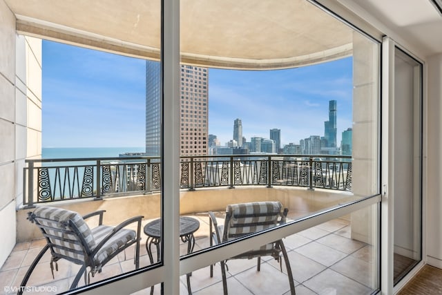 balcony featuring a water view