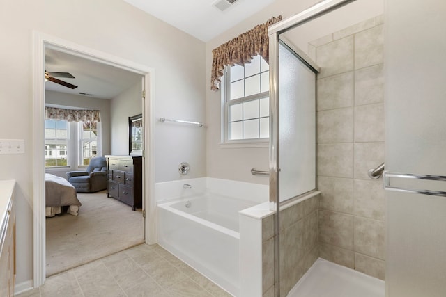 bathroom with ceiling fan, shower with separate bathtub, and tile patterned floors