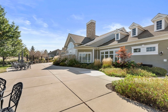 view of property exterior featuring a patio