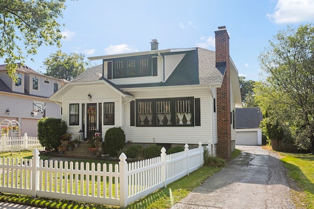 view of front of home featuring a front yard and a garage