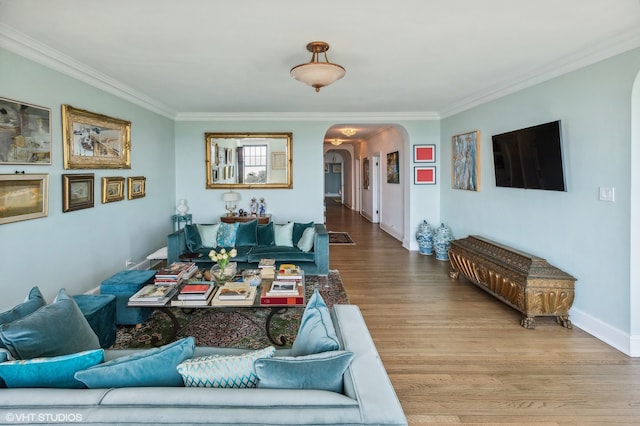 living room with hardwood / wood-style flooring and ornamental molding