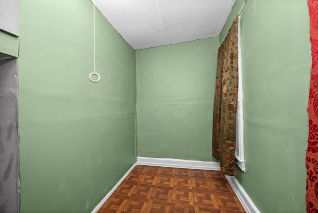 interior space with dark parquet flooring