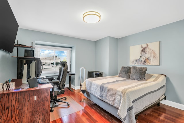 bedroom with hardwood / wood-style flooring