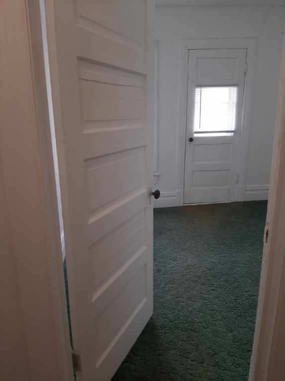 109 E Chamberlin St, Dixon, IL 61021 - corridor with dark colored carpet