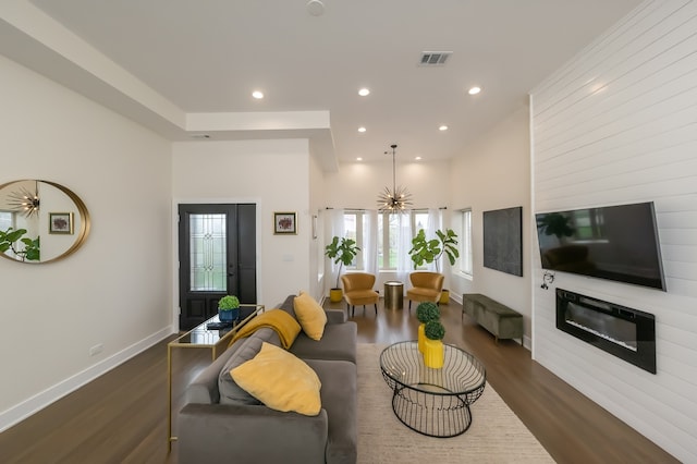 living room with a fireplace and dark hardwood / wood-style floors