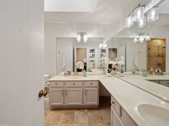 bathroom featuring a shower and vanity