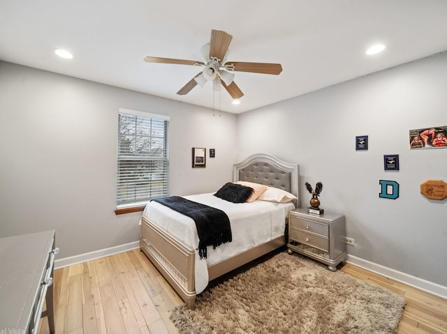 bedroom featuring ceiling fan and light hardwood / wood-style flooring