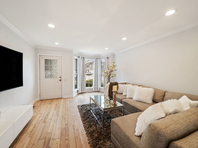 living room with ornamental molding and light wood-type flooring