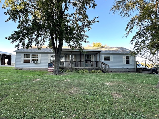 rear view of house with cooling unit and a yard