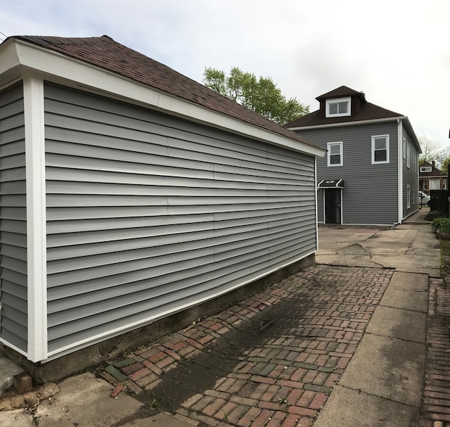 view of side of property with a patio