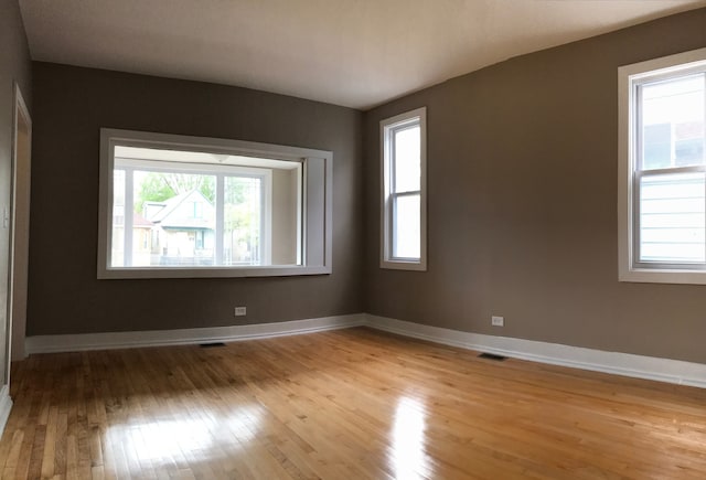 spare room with light hardwood / wood-style floors