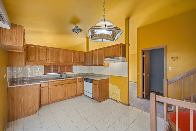 kitchen with decorative backsplash, lofted ceiling with skylight, light carpet, dishwasher, and hanging light fixtures