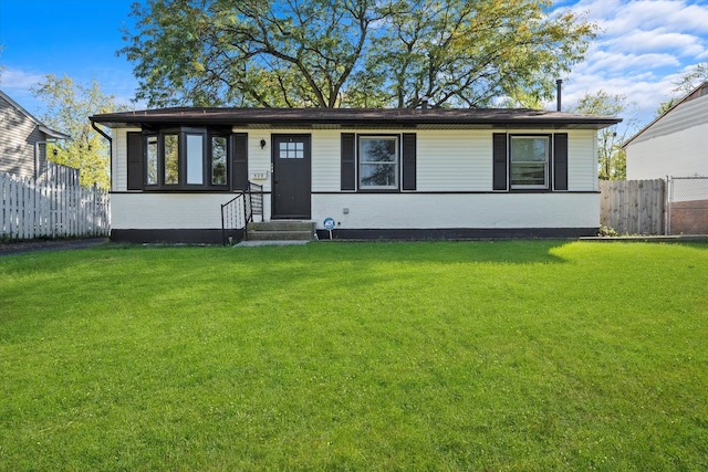 ranch-style home with a front yard