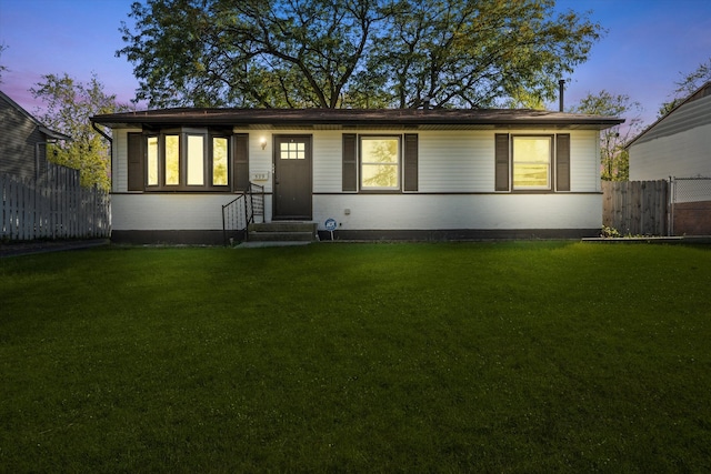 ranch-style house with a lawn