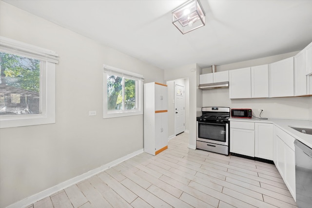 kitchen featuring light hardwood / wood-style floors, stainless steel appliances, and white cabinets