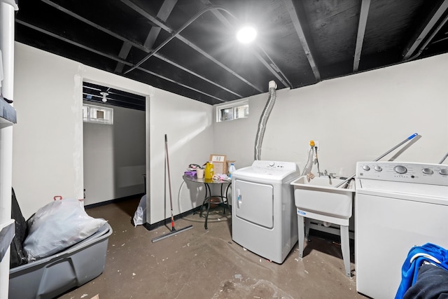 washroom with sink and washing machine and dryer