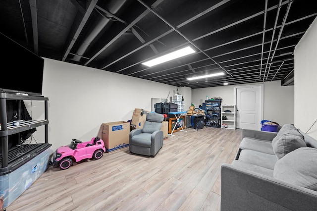 basement featuring hardwood / wood-style flooring