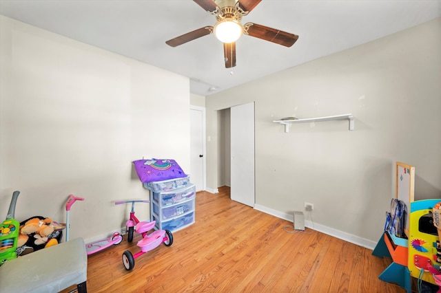 game room with ceiling fan and light hardwood / wood-style flooring