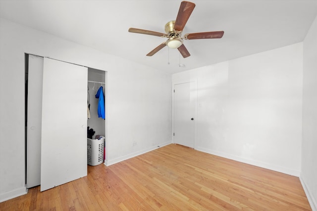 unfurnished bedroom with a closet, hardwood / wood-style floors, and ceiling fan