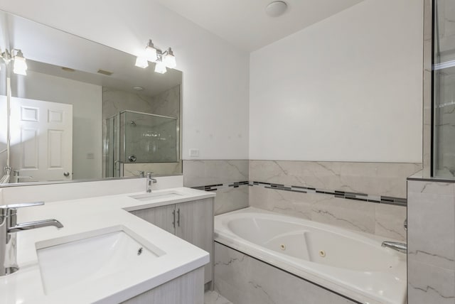 bathroom featuring separate shower and tub and vanity