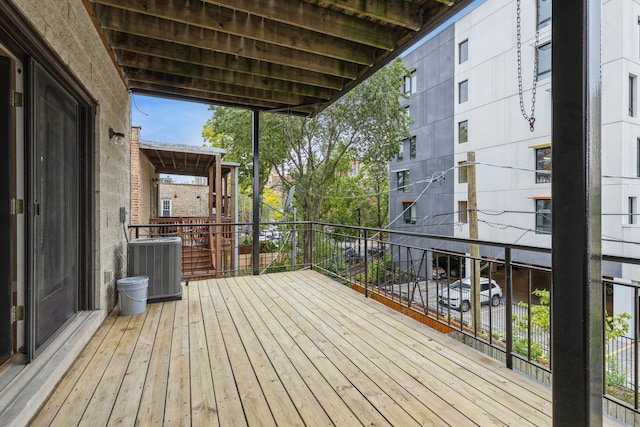 wooden deck with central air condition unit