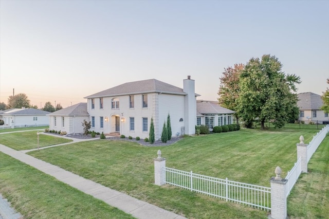 view of front of home featuring a lawn