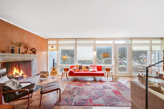 sunroom / solarium featuring a wealth of natural light and a fireplace