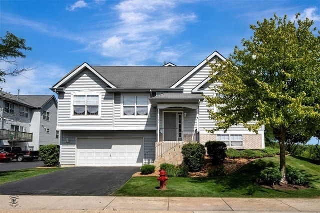 raised ranch featuring a garage