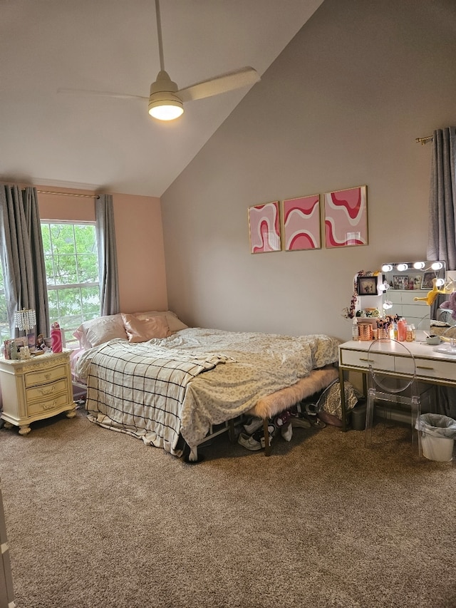 carpeted bedroom featuring lofted ceiling and ceiling fan