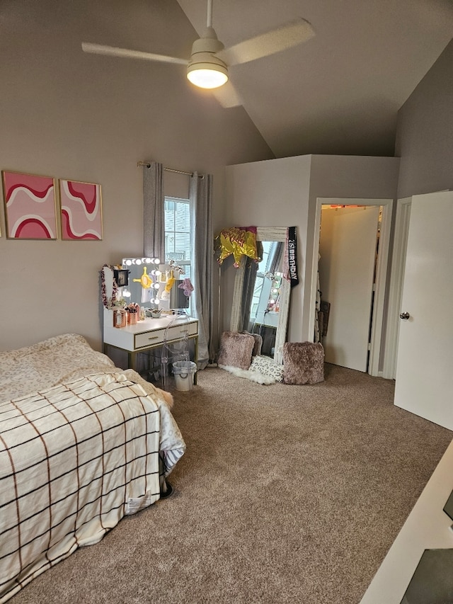 carpeted bedroom featuring ceiling fan and vaulted ceiling