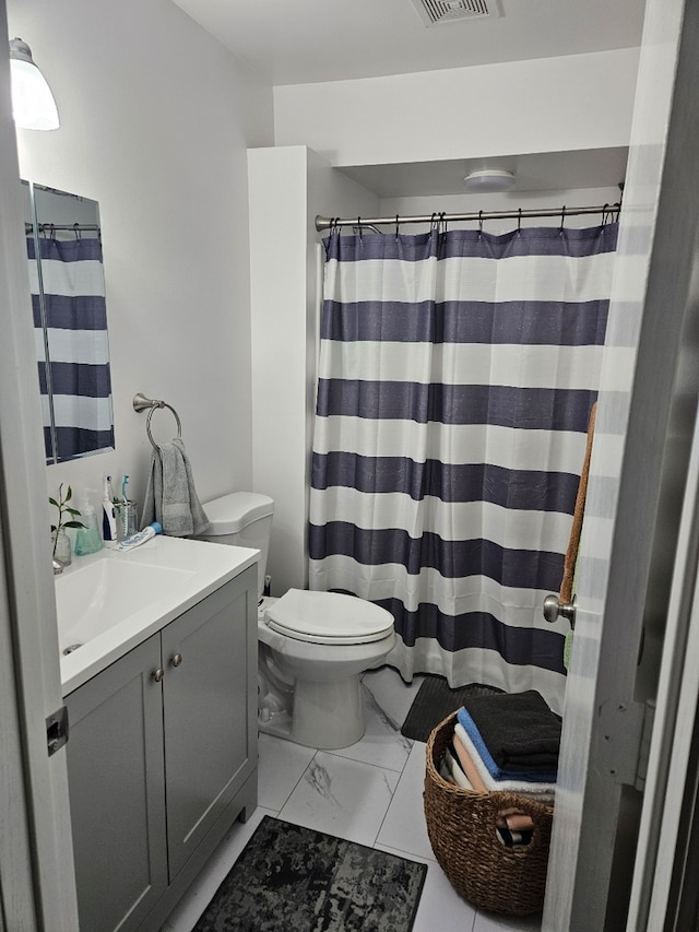 17437 Yakima Dr, Lockport, IL 60441 - full bath featuring vanity, visible vents, toilet, curtained shower, and marble finish floor