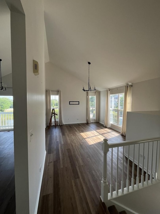 17437 Yakima Dr, Lockport, IL 60441 - interior space featuring high vaulted ceiling, dark wood-style floors, baseboards, and an inviting chandelier