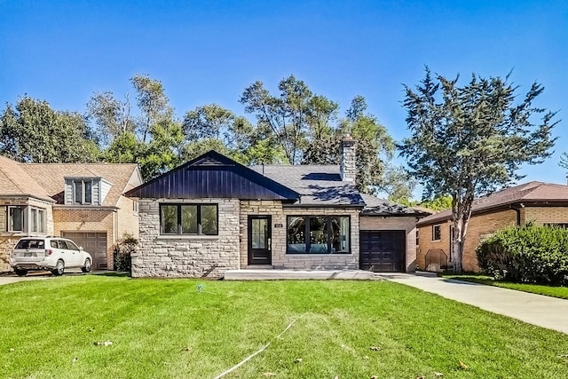 view of front of home with a garage and a front yard