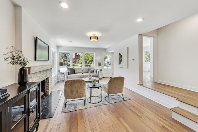 living room with light hardwood / wood-style flooring