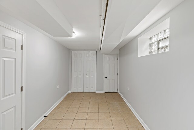 basement with light tile patterned floors