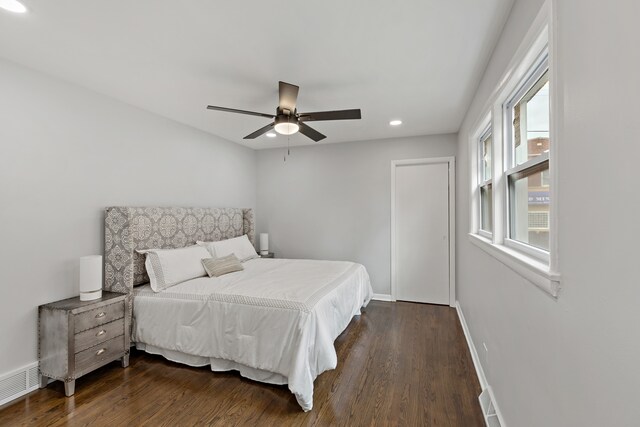 bedroom featuring dark hardwood / wood-style floors and ceiling fan