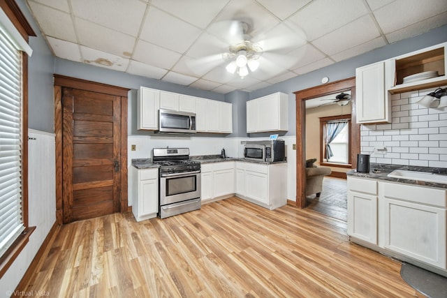 kitchen featuring white cabinets and appliances with stainless steel finishes