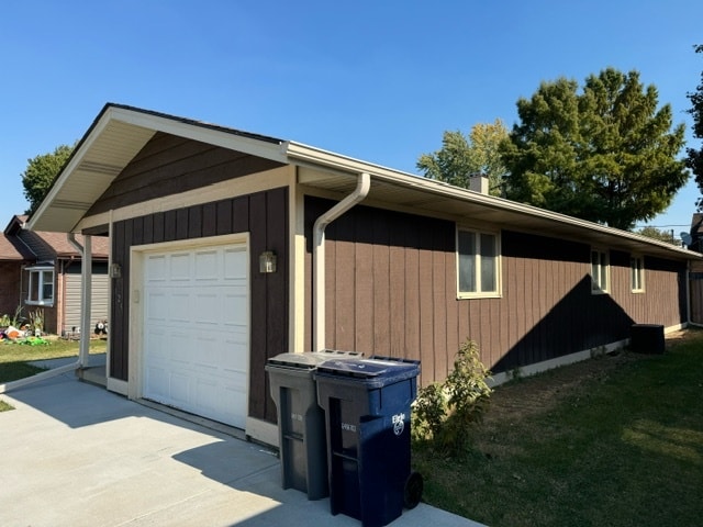 view of property exterior featuring a garage