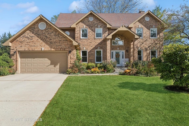 view of front facade featuring a garage and a front lawn