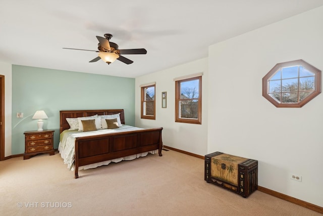 carpeted bedroom with multiple windows and ceiling fan