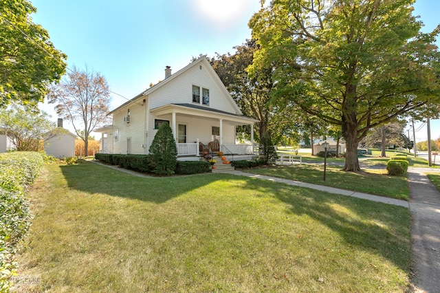 country-style home with a front lawn and a porch