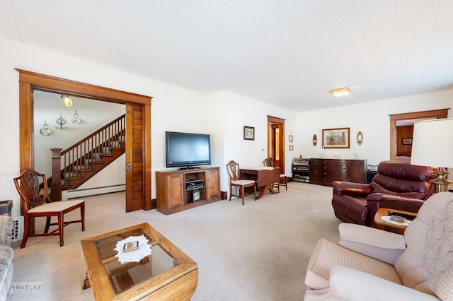 living room featuring stairway, a baseboard radiator, and light colored carpet