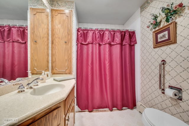 bathroom with vanity, tile walls, toilet, and a shower with shower curtain