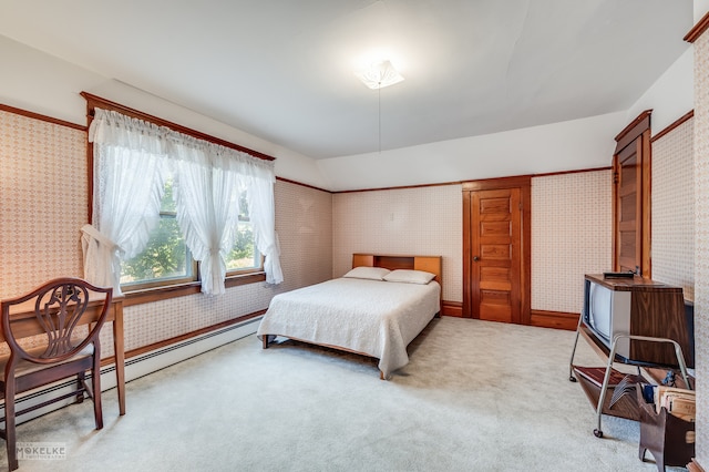 carpeted bedroom featuring a baseboard radiator