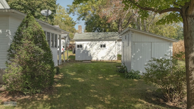 exterior space with an outbuilding and a shed