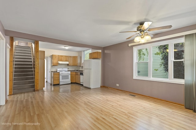 kitchen with ceiling fan, light wood-type flooring, and white appliances