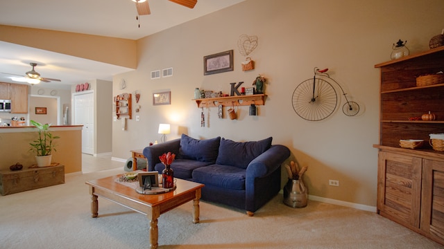 living room featuring light carpet, vaulted ceiling, and ceiling fan