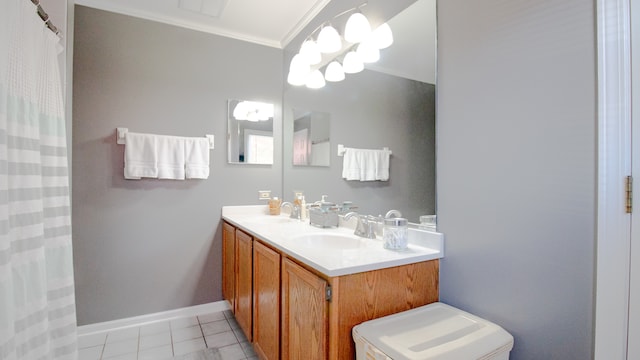 bathroom featuring tile patterned floors, crown molding, vanity, and a chandelier