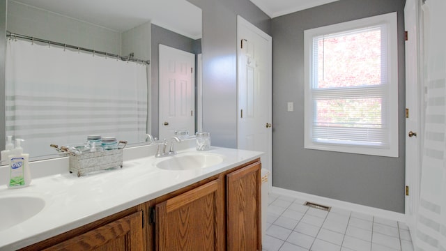 bathroom with tile patterned floors and vanity